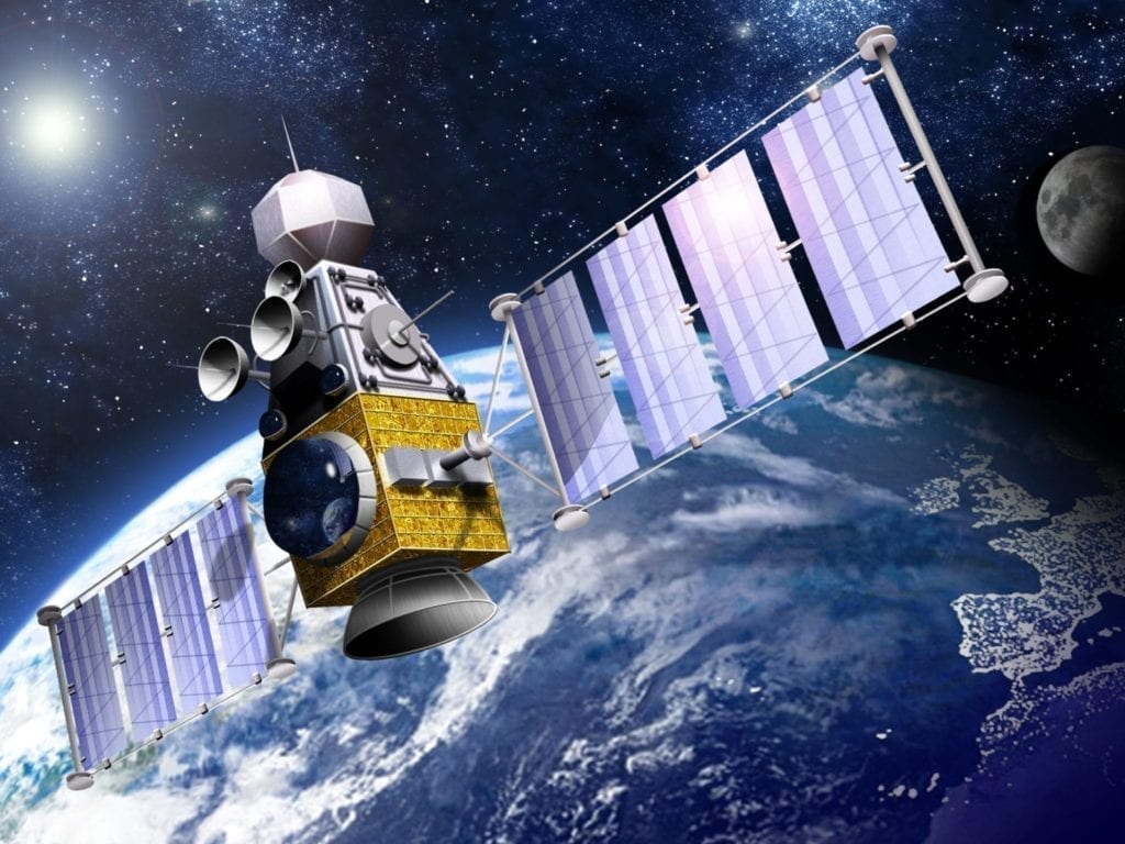 A military satellite in orbit. This satellite is often used for military purposes such as gathering intelligence, or as a weapon.
